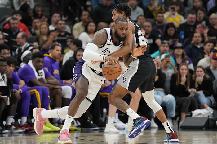 Nov 26, 2022; San Antonio, Texas, USA; Los Angeles Lakers forward LeBron James (6) dribbles in against San Antonio Spurs guard Devin Vassell (24) in the second half at the AT&T Center.
